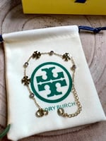 إسوارة TORY BURCH معدن ذهبي بفصوص