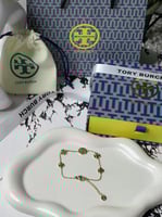 إسوارة TORY BURCH معدن ذهبي بفصوص
