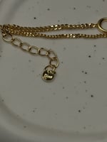 إسوارة Christian Dior ذهبي