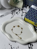 إسوارة TORY BURCH معدن ذهبي بفصوص