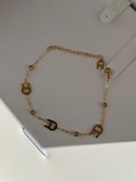 إسوارة AIGNER ذهبي