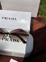 نظارة PRADA إطار أسود- عدسة بني مدرج