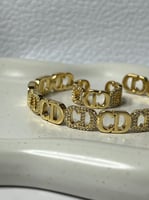 إسوارة+خاتم Christian Dior ذهبي