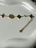 إسوارة LOUIS VUITTON معدن ذهبي