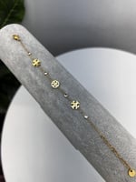 إسوارة TORY BURCH معدن ذهبي بفصوص