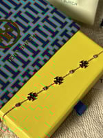 إسوارة TORY BURCH معدن ذهبي بفصوص