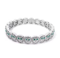 سمايلي فضي بعيون خضراء