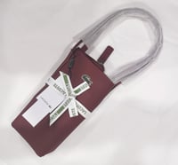 شنطة لاكوست فيس عنابي