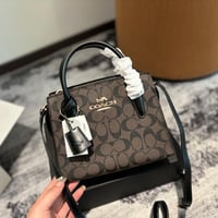 شنطة يد كوتش بني