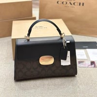 شنطة يد كوتش بني