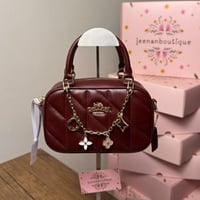 شنطة يد كوتش عنابي