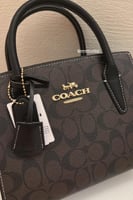 شنطة يد كوتش بني