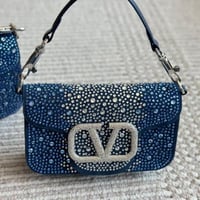 شنطة يد فالنتينو لامع