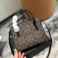 شنطة يد كوتش بني