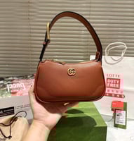 شنطة يد قوتشي