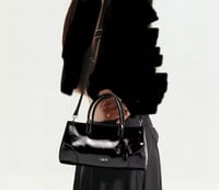 شنطة يد سي اتش جلد أسود