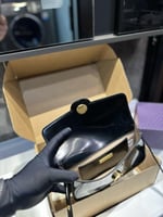 شنطة كتف توري بورش بني