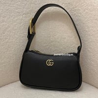 شنطة يد قوتشي