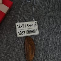 تعليقة لوحة سيارة مع عود