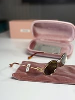 نظارة ميو ميو لوقو اوليف باللون البني Miu Miu Logo...