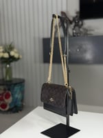 شنطة كوتش كلير اكس سمول بلون بني سجنشر / اسود Mini...