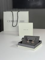 حلق شروتي ناعم بتصميم متدلي مرصع بالكريستال cerrut...