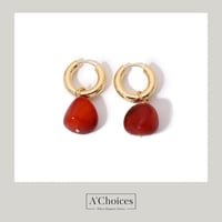 اقراط ذهبية بحجر لون برتقالي