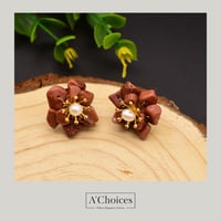 أقراط مصنوعة يدوياً من الفضة والنحاس المطلي بالذهب...