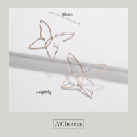 أقراط مصنوعة من النحاس على شكل فراشة