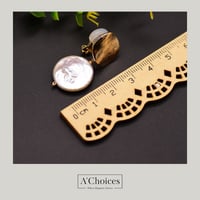 أقراط مصنوعة يدوياً من الفضة والنحاس المطلي بالذهب...