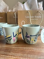 كوب برسم اليد