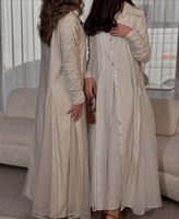 فستان رمضاني لنن مقلم باطراف رفلز