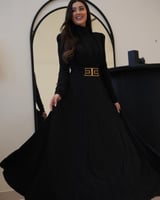 ‎فستان ترتر اسود جيرسيه برقبة عالية ودرابيه عالصدر...