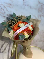 بوكيه ورد مع شريطه ألف مبروك