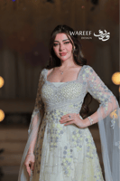 فستان سهرة ليموني مطرّز بلمسات فضية ساحرة وأكتاف ش...