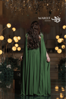 فستان سهرة أخضر ملكي بتطريز مخملي فاخر وتصميم مستو...