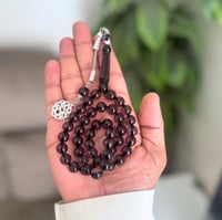 سبحة من بكلايت باللون الاسود الشفاف