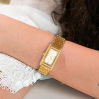 ساعة نسائيه ستيل ذهبي مينا فضي 10024