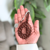 سبحة من بكلايت باللون عنابي شفاف