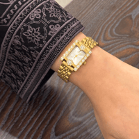 ساعة نسائية الودرة بسير استيل ذهبي EL005