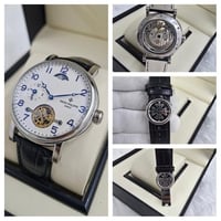 ساعه باتك فليب جلد اسود مع فضي مينا ابيض