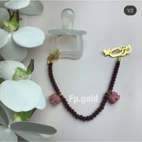 بروش مع تعليقه لهايه كرستال عنابي مع فيل بدون الله...