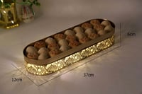 صحن مضيء يعمل بطارية