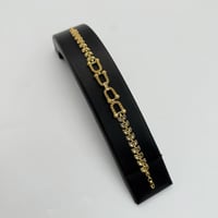 سوارة ذهب غصن الزيتون بتصميم حلقات المونيكاء عيار...