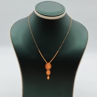 عقد ذهب عيار 21 زخارف دائرية وزن 1.29 جرام بتعليقة...