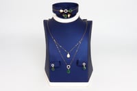 طقم ذهب بوشرون الملون تصميم الماسي عيار 18 وزن 4.4...