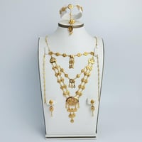 طقم ذهب فخم عيار 18 بمخنقين وزن 23.6 جرام