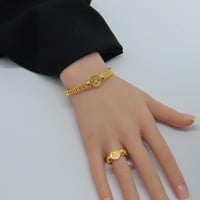 اسوارة مع خاتم ذهب عيار 21 بتصميم الجنية وزن 14.17...