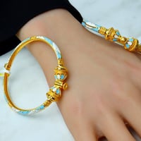 افخم اسوارة ذهب عيار 21 تصميم هندي ملون بوزن 14.8...