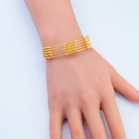 اسوارة ذهب متعددة الخيوط بتفاصيل كروية عيار 21 وزن...